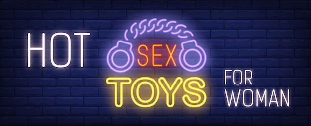 Hot sex toys für frau leuchtreklame. handschellen auf dunkle mauer.