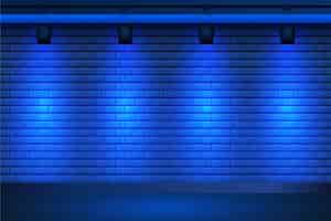 Kostenloser Vektor scheinwerfer auf blauem backsteinmauerhintergrund