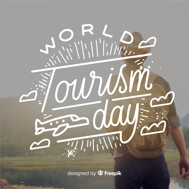 Kostenloser Vektor world tourism day schriftzug mit reisenden