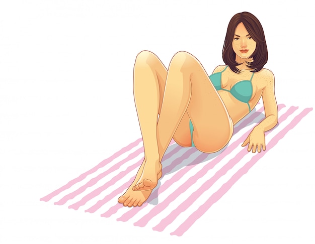 Bikinimädchen, das auf einem Strandtuch liegt
