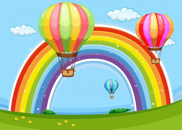 Bunte ballone, die über den regenbogen fliegen
