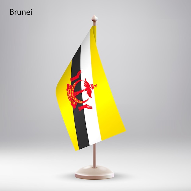 Die Flagge von Brunei hängt auf einem Fahnenständer