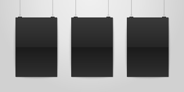 Drei realistische, schwarze, leere, vertikale a4-papierposter, die an einem seil mit binderclip-attrappe hängen