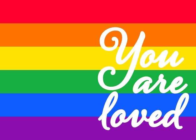 Du bist geliebte Worte auf dem Hintergrund der LGBT-Stolzflagge