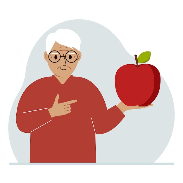 Ein alter mann hält einen frischen und roten apfel in der hand man isst einen apfel gesundes ernährungskonzept