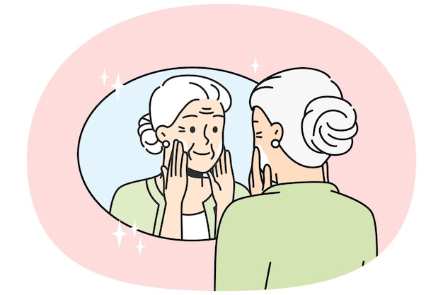 Eine ältere dame setzt sich zu hause anti-aging-creme auf das gesicht