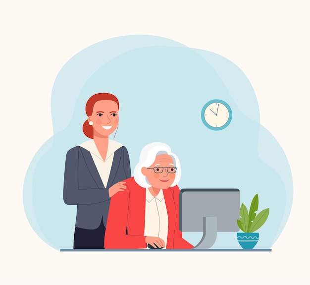Eine ältere Person am Computer unterrichten.