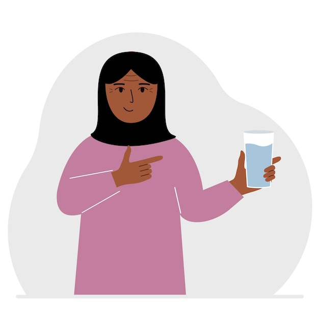 Eine Frau hält ein Glas Wasser in der Hand Das Konzept des Wasserhaushalts und der Gesundheit