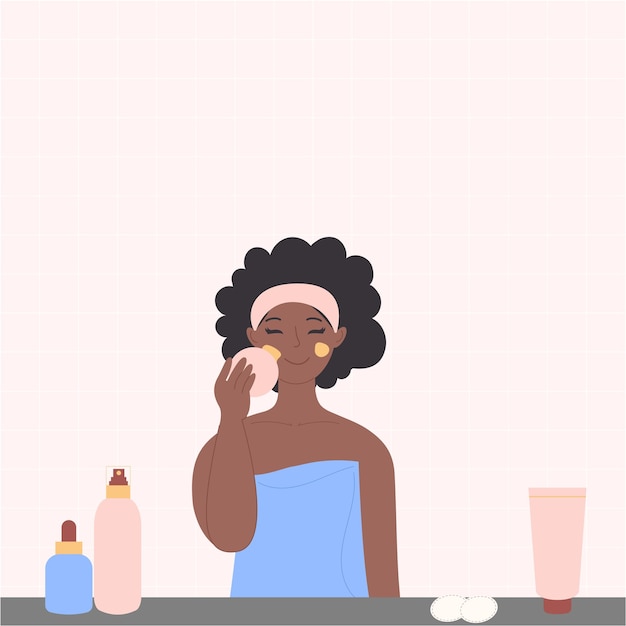 Eine schwarze afroamerikanische Frau wäscht ihr Gesicht mit Kosmetik im Badezimmer