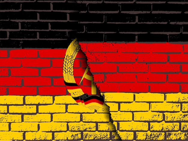 Eine zerstörte mauer mit der flagge deutschlands über der flagge der ddr