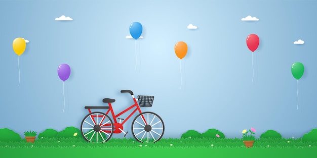 Fahrrad im Garten mit bunten Luftballons, die im Papierkunststil schweben