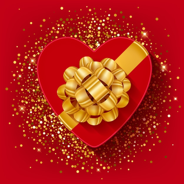 Geformte geschenkbox st. valentines herz mit goldband und -bogen.