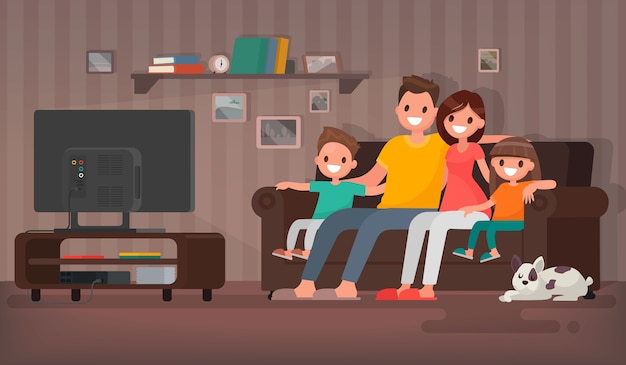 Glückliche familie beim fernsehen sitzen auf der couch zu hause