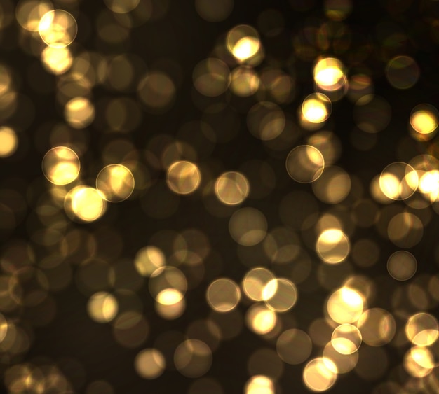 Gold bokeh unscharfes licht auf schwarzem hintergrund. goldene lichter abstraktes glitzern defokussierte blinkende sterne und funken.