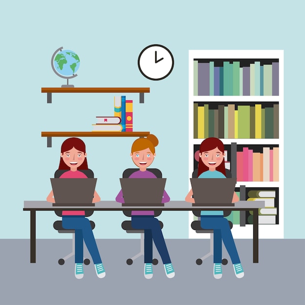 Gruppenmädchen, die im Klassenzimmer mit dem Laptoplernen sitzen