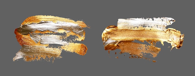 Vektor handzeichnung gold pinselstrich farbfleck auf grauem hintergrund