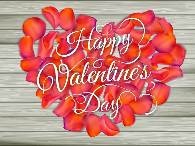 Herz aus Blumen auf Holztisch. Vintage Valentinstag Hintergrund.