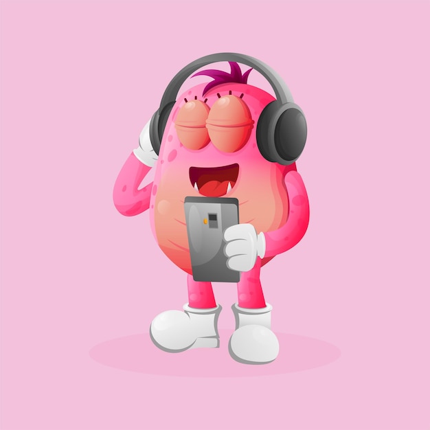 Hörende musik des netten rosa monsters auf einem smartphone unter verwendung eines kopfhörers