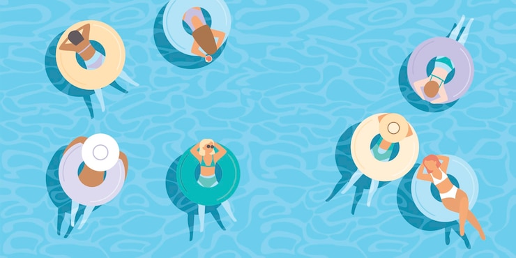 Junge Mädchen, die auf bunten aufblasbaren Ringen im blauen Poolwasser schwimmen. Luftaufnahme von oben