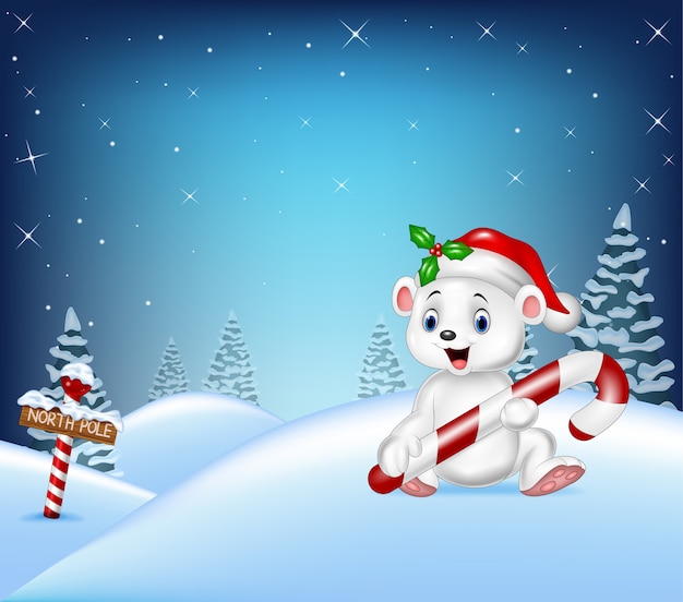 Karikatur Weihnachtshintergrund mit dem Eisbären, der Süßigkeit hält