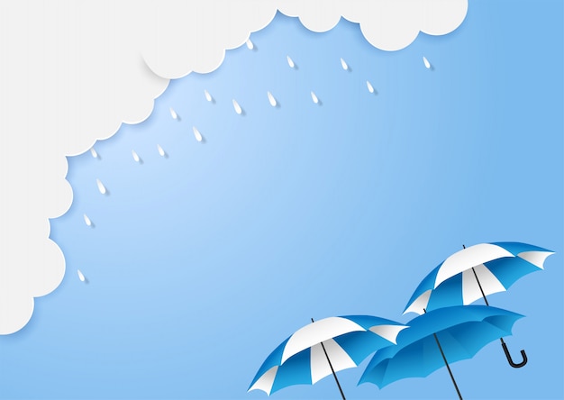 Monsun, regenzeithintergrund mit copyspace. wolkenregen und -regenschirm auf blauem himmel.
