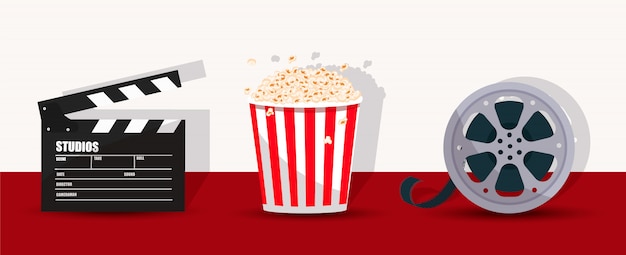 Popcorn, Filmklappe und Filmstreifen.