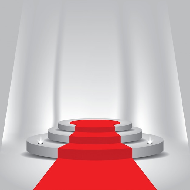 Roter teppich zum podium mit scheinwerfern