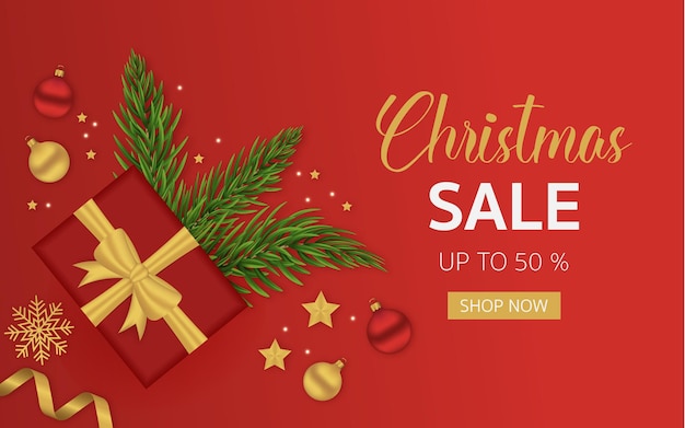 Rotes Weihnachtsverkaufsbanner mit Weihnachtsspielzeug und Tannenzweigen