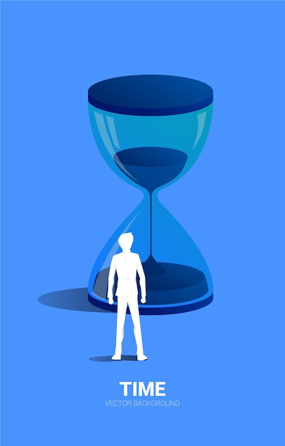 Silhouette eines Geschäftsmannes, der mit Sanduhr-Konzept für Büroangestellte und Arbeitszeit steht