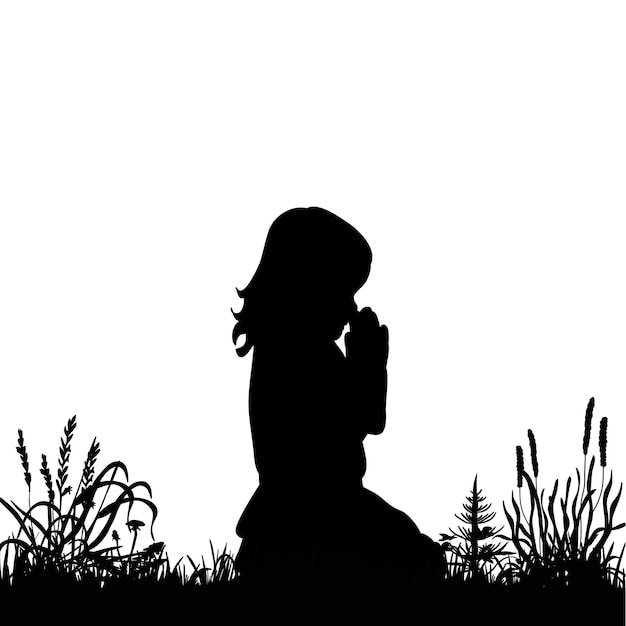 Silhouettieren Sie das kleine Mädchen, das auf dem Gras betet