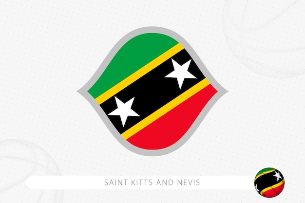 St. kitts und nevis-flagge für basketballwettbewerb auf grauem basketballhintergrund.