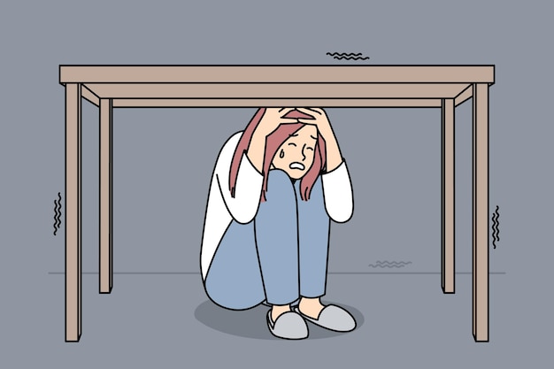 Unglückliche gestresste frau versteckt sich unter dem tisch