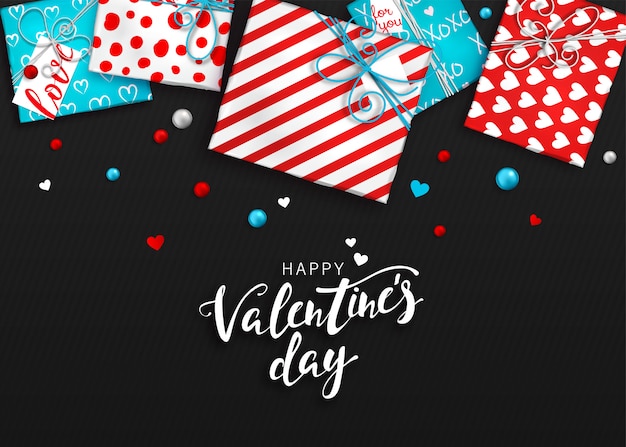 Valentinstag hintergrund. rote und blaue geschenkboxen im packpapier