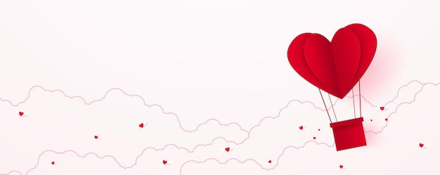 Valentinstag liebe konzept hintergrundpapier roter herzförmiger heißluftballon, der in den himmel schwimmt