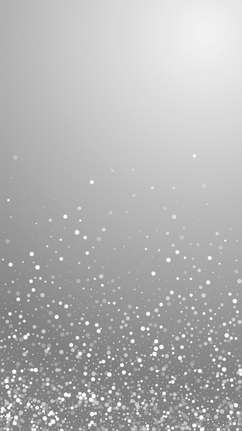 Zufällige weiße Punkte Weihnachtshintergrund. Subtile fliegende Schneeflocken und Sterne auf grauem Hintergrund. Ansprechende Winter-Silber-Schneeflocken-Overlay-Vorlage. Perfekte vertikale Abbildung.