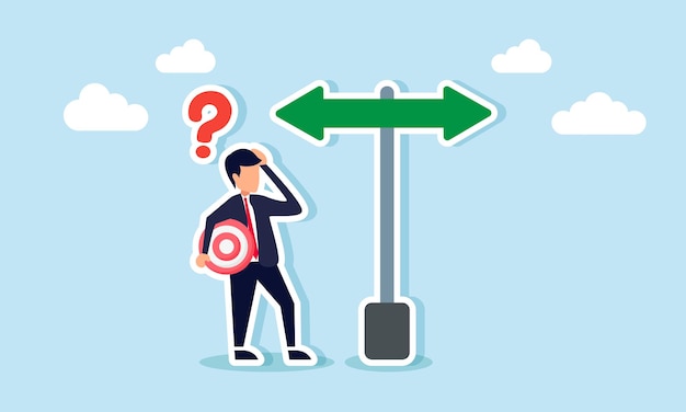 a businessman holding a target board feels confused about which direction to take
