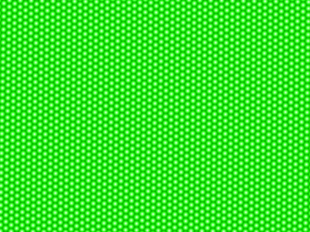 abstract pattern of dots circles and hexagons on green surface