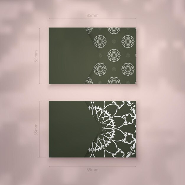 Business card template in dark green color with Greek white ornaments for your business.