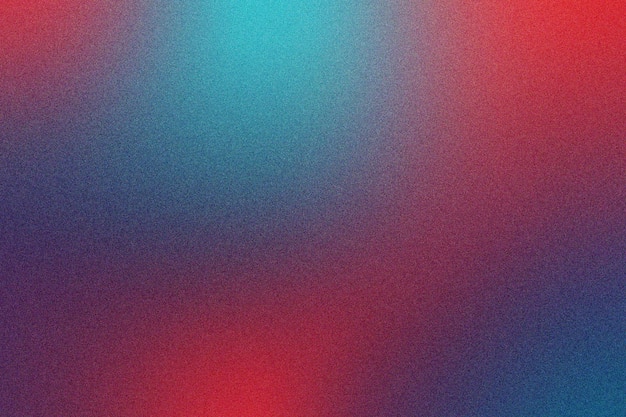 colorful gradient grainy texture background in red turquoise and indigo hues