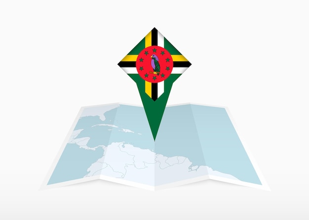 dominica is depicted on a folded paper map and pinned location marker with flag of dominica