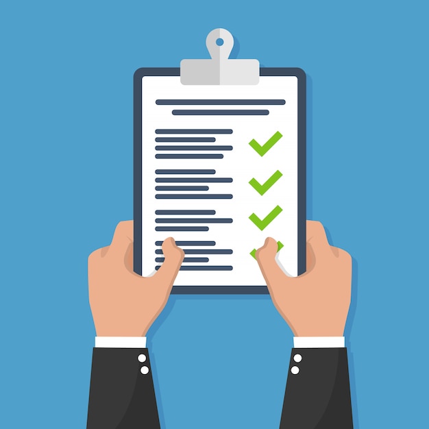 Hand holding clipboard with checklist