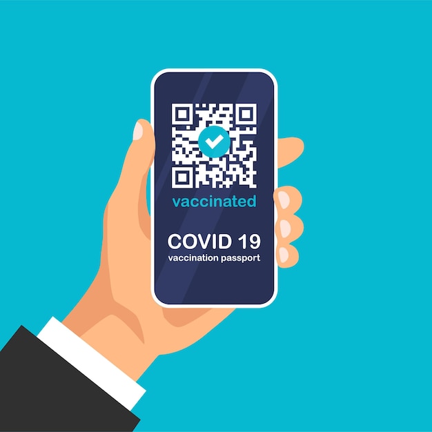 hand holds covid-19 vaccination passport app. certificate with qr code on smartphone screen.