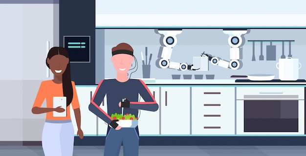 woman using mobile app controlling man humanoid with wires electrodes indicators smart handy chef robot preparing food robotic assistant concept modern kitchen interior  horizontal portrait