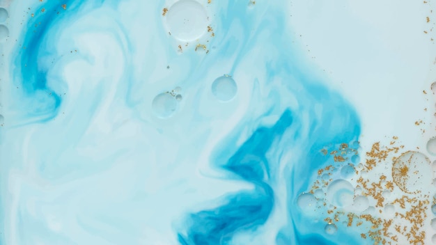 Aquarela azul abstrata com vetor de fundo de glitter dourados