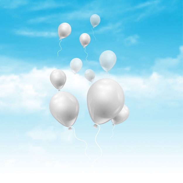 Balões flutuando em um céu azul com nuvens brancas macias
