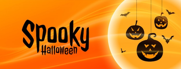 Vetor grátis banner de halloween assustador com formas de abóbora penduradas