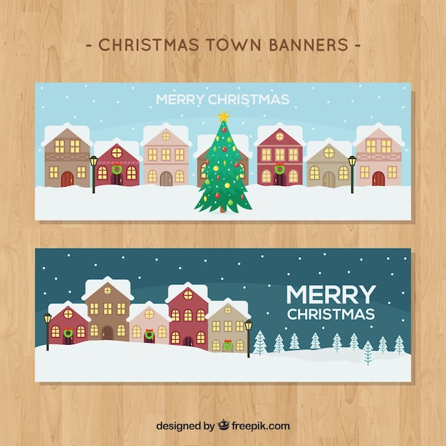 Banners de árvore de natal com casas em design plano