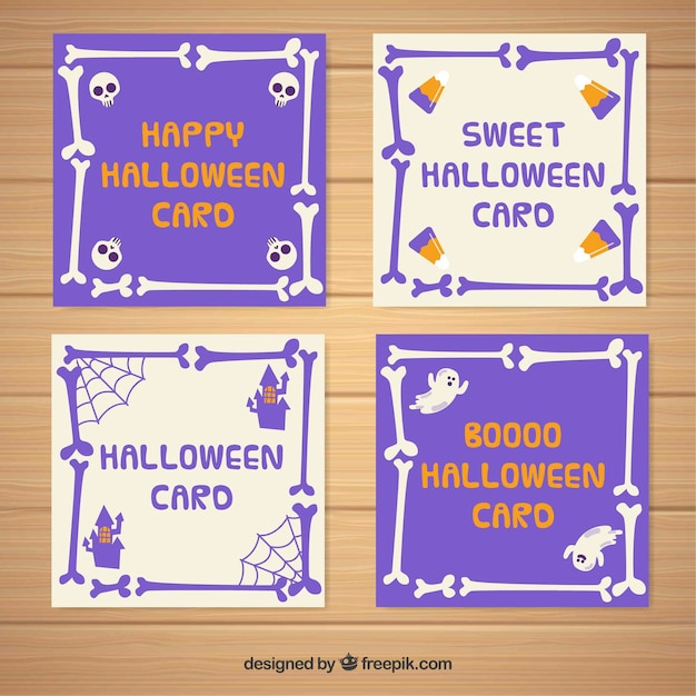 Vetor grátis conjunto de quatro cartões de halloween com ossos