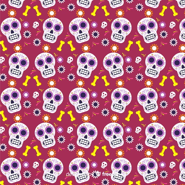 Vetor grátis dia de muertos liso vermelho com padrão de caveiras