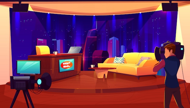 Estúdio de televisão com câmera, luzes, mesa para apresentador, sofá para entrevista e gravação de programa de tv, show.